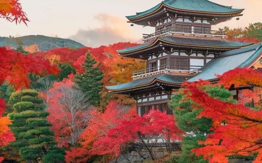 A temple building at Nikko surrounded by autumn maples