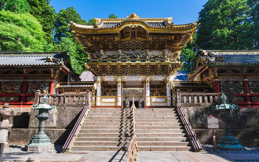 The gilded Yomeimon gate at Nikko Toshogu above its stone steps