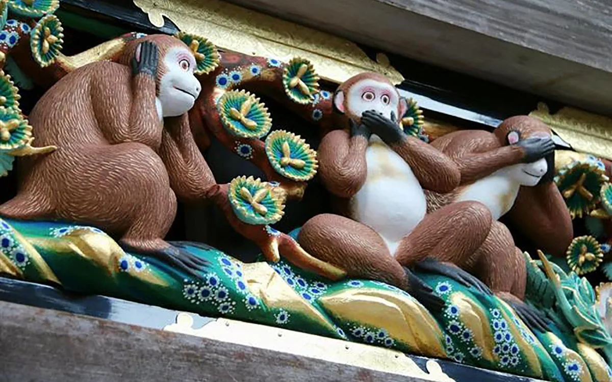 The three wise monkeys carving on the sacred stable at Nikko Toshogu